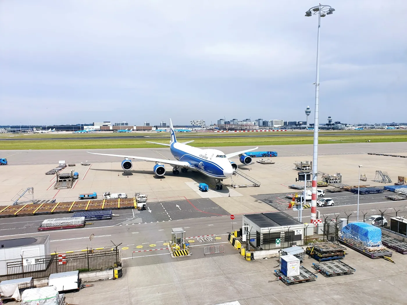 A freighter at Amsterdam Schiphol, the control tower behind it.